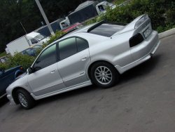 2 899 р. Козырёк на заднее стекло LIBERAL Mitsubishi Galant 8  дорестайлинг седан (1996-1998) (Неокрашенный)  с доставкой в г. Пермь. Увеличить фотографию 2