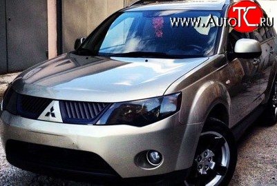 1 529 р. Темная защита передних фар SIM Mitsubishi Outlander XL (CW)  дорестайлинг (2005-2009)  с доставкой в г. Пермь
